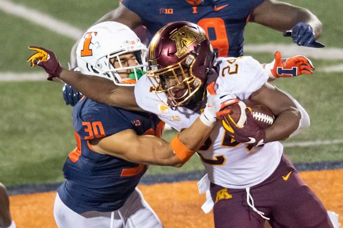 Minnesota Golden Gophers running back Mohamed Ibrahim (24) runs the ball against Illinois Fighting Illini defensive back Sydney Brown (30) during the second half at Memorial Stadium.